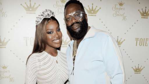 Two black couple standing with each other, both weared a white outfits