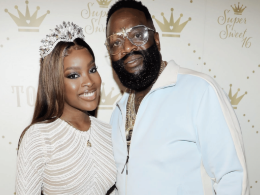 Two black couple standing with each other, both weared a white outfits